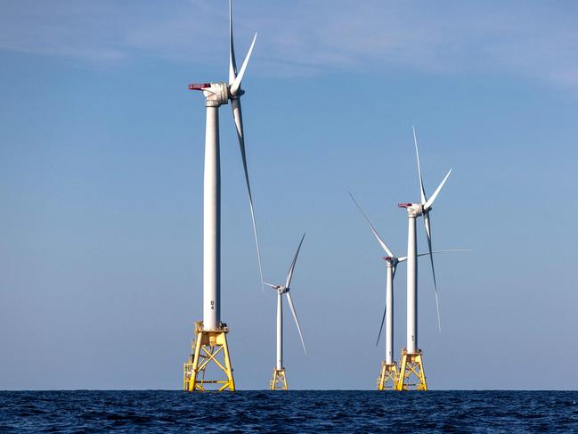 (FILES) Wind turbines generate electricity at the Block Island Wind Farm on July 7, 2022 near Block Island, Rhode Island. They're âuglyâ, âruin the landscapeâ and âkill whalesâ: Donald Trump accuses wind turbines of all sorts of evils and plunged their industry into turmoil as soon as he returned to the White House. âWe're not going to do the windmill thing,â the American president launched on January 20, the day of his inauguration, before digressing on the subject. âThey kill birds and ruin beautiful landscapesâ, âthey're all made in Chinaâ and âif you like whales, you don't want wind turbines eitherâ, said the Republican, before signing a series of executive orders at the end of the day to put a spanner in the industry's works. (Photo by JOHN MOORE / GETTY IMAGES NORTH AMERICA / AFP)