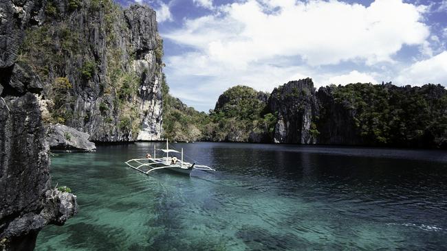 A motorised bangka in Palawan’s coral-filled Miniloc Island lagoon.