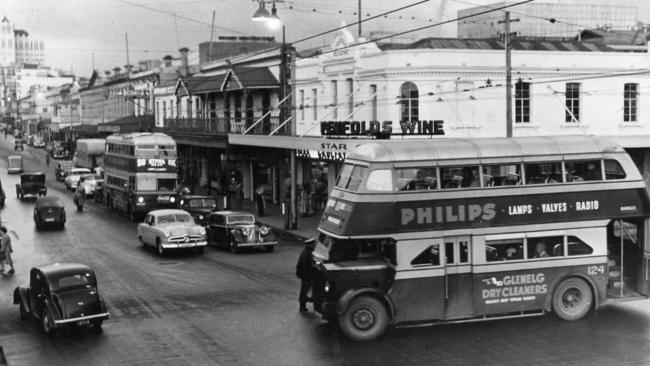 An electric double-decker trolley bus with at the intersection of Morphett and Hindley streets, Adelaide, June 1952. You can see the stairs leading upwards at the back of the bus.