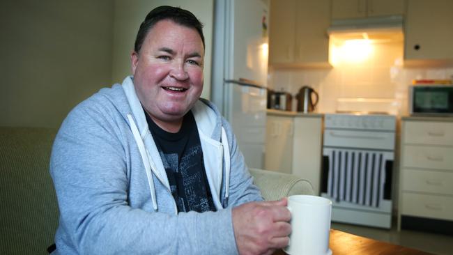 Shane inside his refurbished flat in Riverwood provided for him by Department of Family and Community Services. Picture: Angelo Velardo