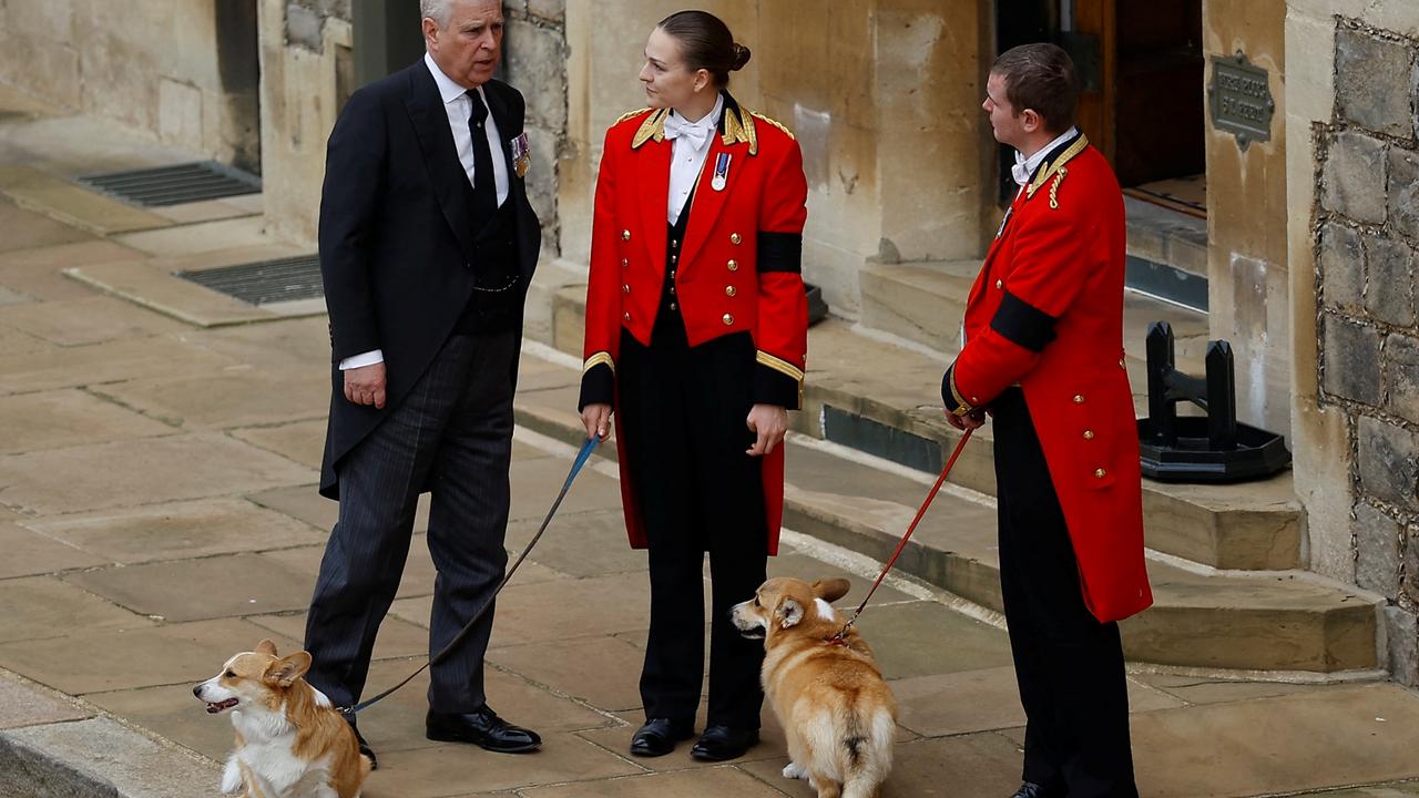 Prince Andrew, Duke of York, enquires how the corgis are as they wait for the hearse to pass by. Picture: Peter Nicholls – WPA Pool/Getty Images