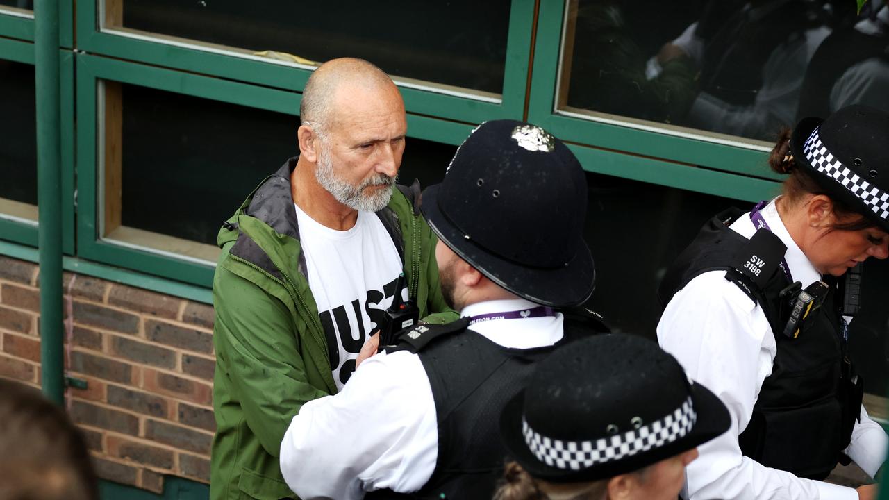 Court invasion brings Wimbledon to a halt