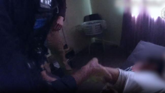 Detectives released vision of the arrests, showing Bligh was found hiding in a bedroom cupboard. Picture: QPS
