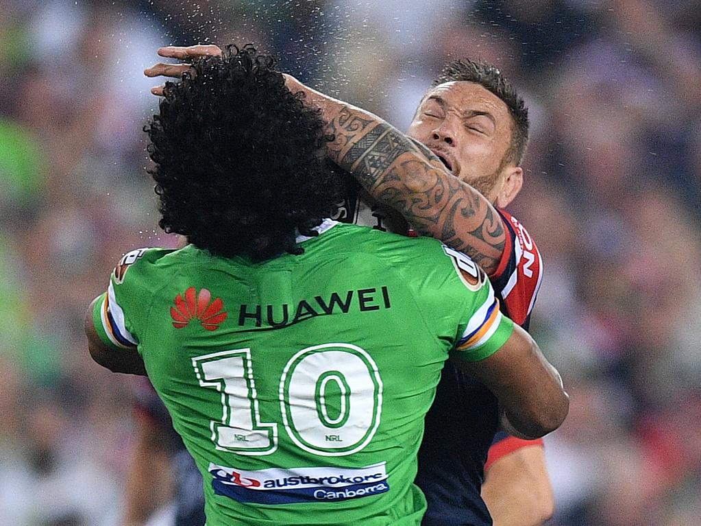 Jared Waerea-Hargreaves of the Roosters is tackled by Iosia Soliola of the Raiders during the 2019 NRL Grand Final between the Canberra Raiders and the Sydney Roosters at ANZ Stadium in Sydney, Sunday, October 6, 2019. (AAP Image/Dan Himbrechts) NO ARCHIVING, EDITORIAL USE ONLY