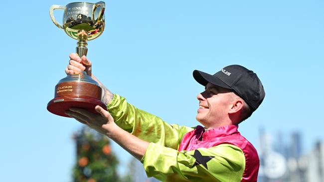 Robbie Dolan with the Melbourne Cup trophy after riding Knight's Choice to a stunning victory at Flemington last November. Picture: Vince Caligiuri/Getty Images