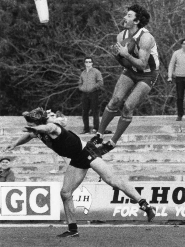 Footballer Grenville Dietrich takes a spectacular mark over West Adelaide’s Craig Williams at Prospect Oval in 1984.