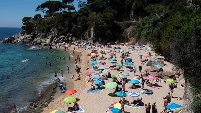 People enjoy a day out at the beach in Platja D’Aro near Girona after three months of lockdown. Picture: AFP.