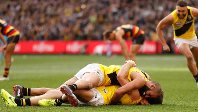 Bachar Houli and Trent Cotchin celebrate after the siren.