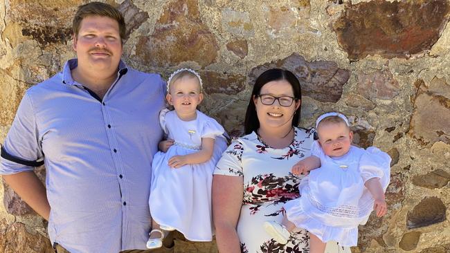 Raya Pyke (R) with (L-R) dad Matthew, older sister Eve, and mum Abbe Pyke. Raya is battling a rare stage four childhood cancer. Picture: Supplied by family