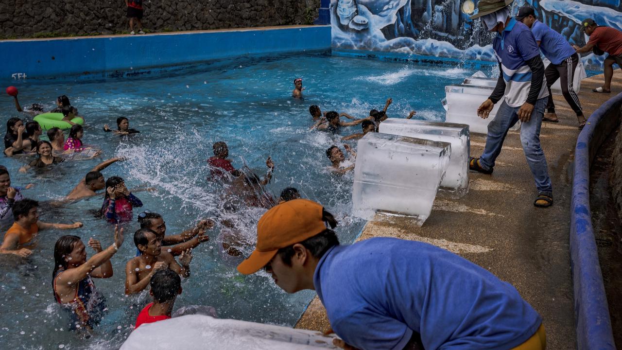 Workers dump blocks of ice at a pool amid extreme heat at the Hidden Sanctuary Resort on May 04, 2024 in Marilao, Bulacan province, Philippines. Picture: Ezra Acayan/Getty Images