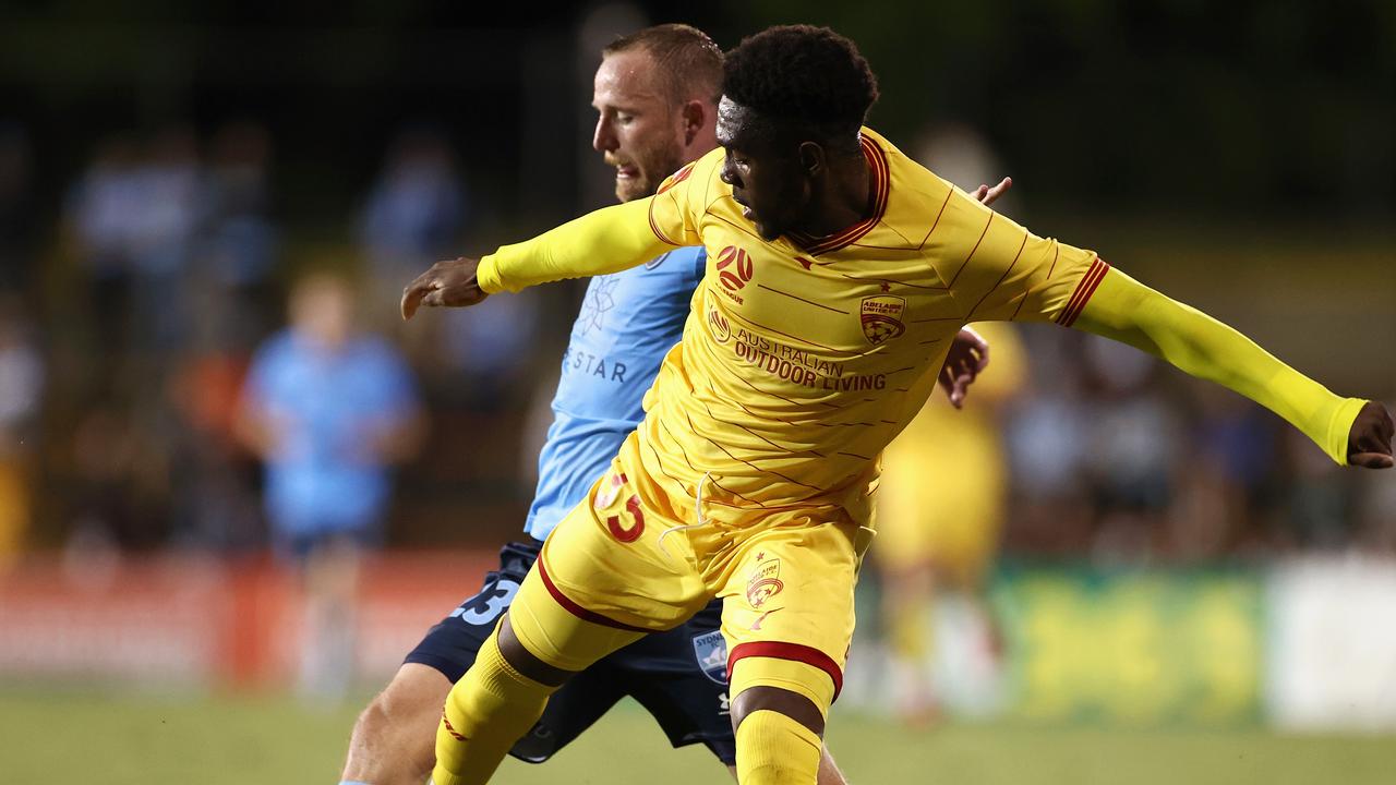 Al Hassan Toure taking on Rhyan Grant of Sydney FC.