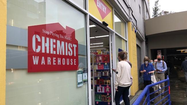 Customers line up at Chemist Warehouse in Salamanca in search of rapid antigen tests (RAT). Picture: Nikki Davis-Jones