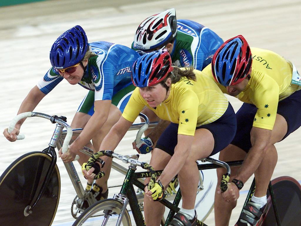 Italian cyclist Serenella Bortolotto overtaking Kerry and Kieran Modra in the mixed tandem sprint race at Paralympic Games in Sydney, on October 23, 2000.