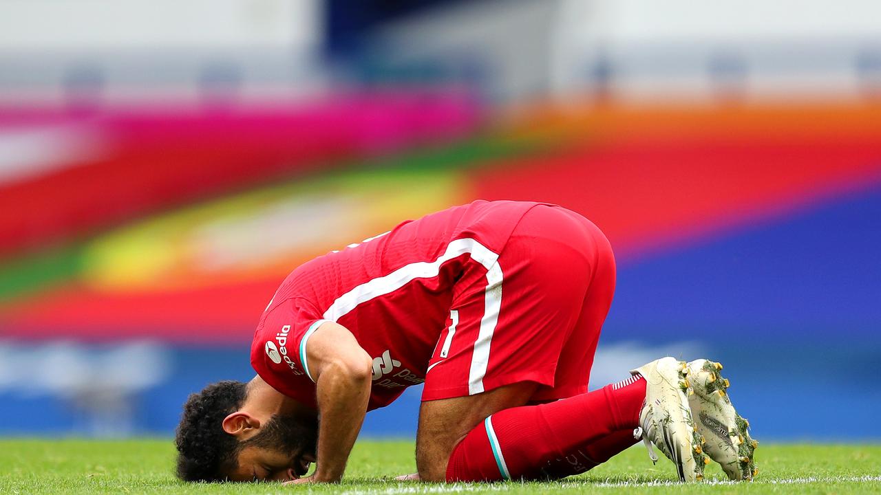 LIVERPOOL, ENGLAND - OCTOBER 17: Mohamed Salah of Liverpool celebrates after scoring his team's second goal during the Premier League match between Everton and Liverpool at Goodison Park on October 17, 2020 in Liverpool, England. Sporting stadiums around the UK remain under strict restrictions due to the Coronavirus Pandemic as Government social distancing laws prohibit fans inside venues resulting in games being played behind closed doors. (Photo by Catherine Ivill/Getty Images)