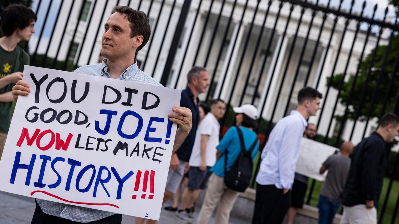 A man holds a sign showing his appreciation for US President Joe Biden along Pennsylvania Avenue in front of the White House in Washington, DC. Picture: Samuel Corum/AFP