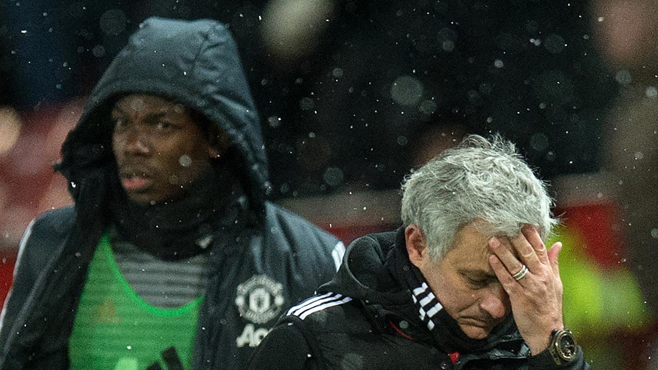 The row between Paul Pogba (L) and Jose Mourinho continues