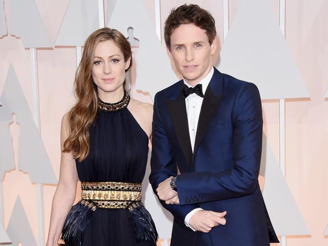 Actor Eddie Redmayne, with wife Hannah Bagshawe, on the Oscars red carpet in 2015. Picture: Jason Merritt/Getty Images