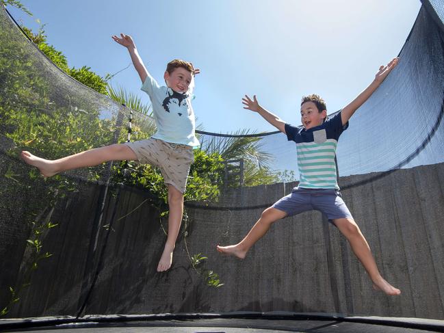 Archie, 5, and Alex, 7, playing on their trampoline. Picture: Jay Town