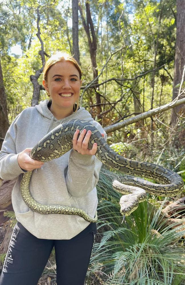 Summer Woolston with a python. Picture - contributed.