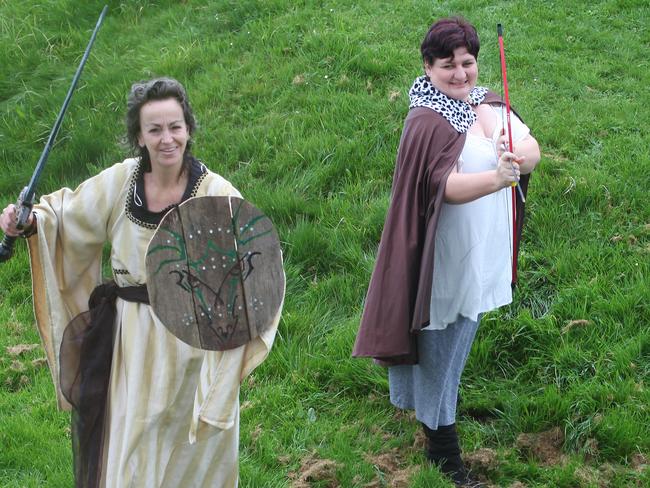 DVG. Derwent Valley Gazette. Pictured at Kensington Park is the Medieval Festival organisers promoting the festival. (L-R) Erin Edge, Debbie Fenton, Maree Reiper with Conor (Conor) Fenton in stocks. PIC: MATT THOMPSON