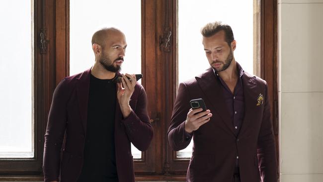 Andrew Tate, left, and his brother Tristan, right, wait at the Court of Appeals building in Bucharest, Romania, on Oct. 15, 2024. Picture: AP Photo/Vadim Ghirda