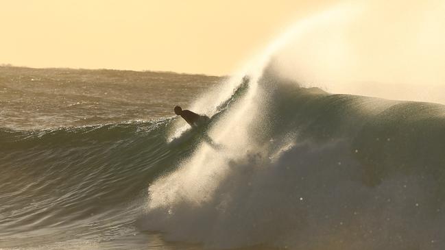 Surfers brave the cold in Bronte. Picture: John Grainger