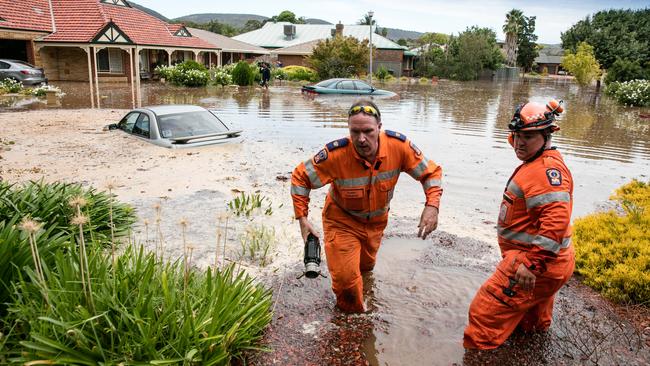 The extraordinary scene at Willow Dr, Paradise, last week, where two mains burst in four places, flooding homes and cars. Picture: Russell Millard