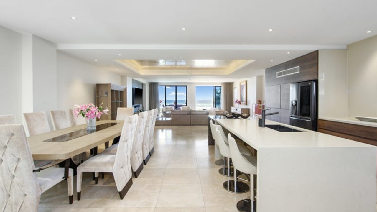 Stone island bench and a large butler’s pantry in the kitchen