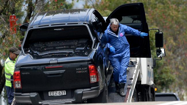 Police remove a car from the crime scene after the shooting of Mejid Hamzy at Condell Park.