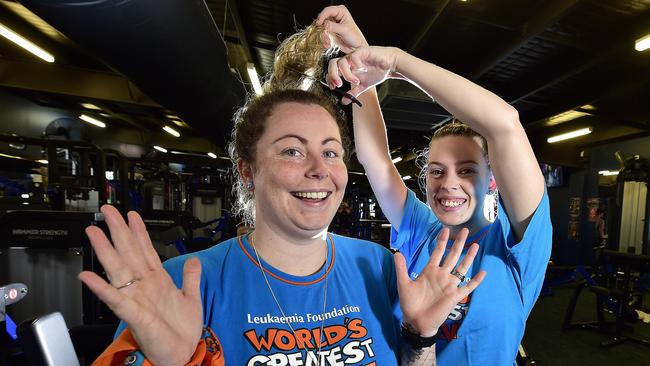 Townsville mum Emma Buddeke will shave her mid-back length hair for the 2nd time on March 14 as part of World's Greatest Shave, and the first cut will be done by good friend Amanda Jones. PICTURE: MATT TAYLOR.