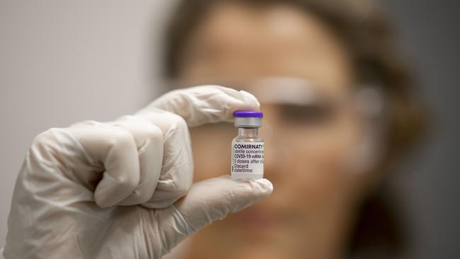 A vial of Covid-19 vaccine is held by advanced pharmacist Rachael Raleigh at Gold Coast University Hospital.