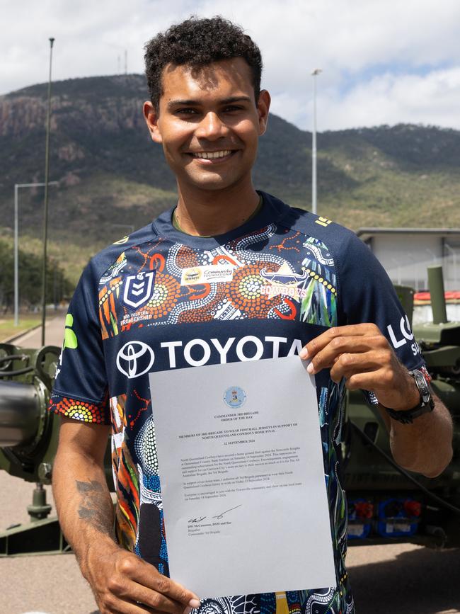 Lance Bombardier Liam Stone from 4th Regiment holding the ‘Order of the day’ while wearing his North Queensland Cowboys jersey in support of the home game final, on 13 September 2024, at Lavarack Barracks. Photo: CPL Guy Sadler