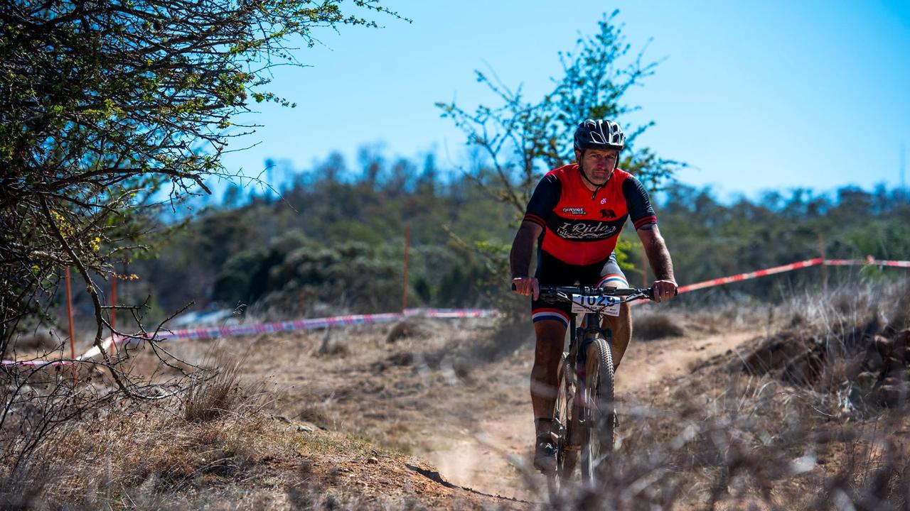 Trent West on the path to victory in the national solo 24-hour mountain bike championships in Armidale.