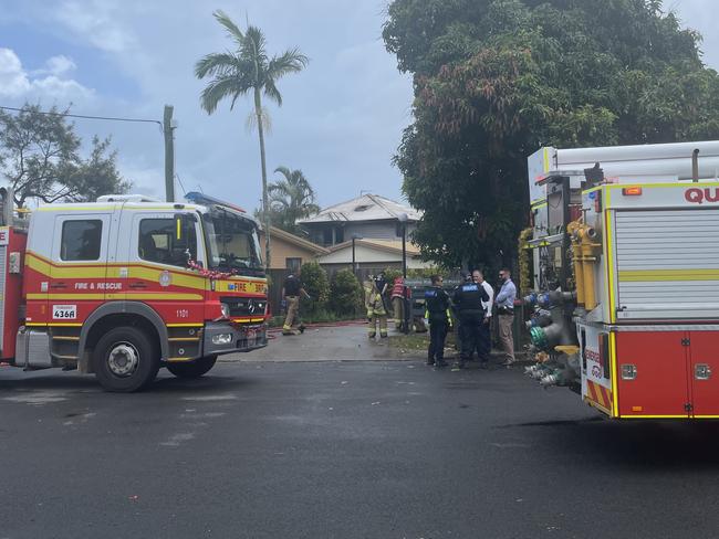 Police investigators enter a George St apartment block to determine what caused the fire on December 16.