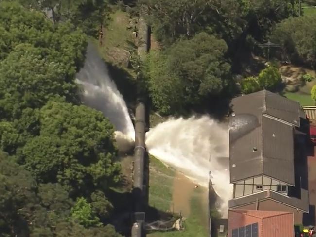 The pipeline in Como, Sydney, burst on Friday afternoon and sent torrents of water pouring into nearby homes. Picture: Supplied / 9 News