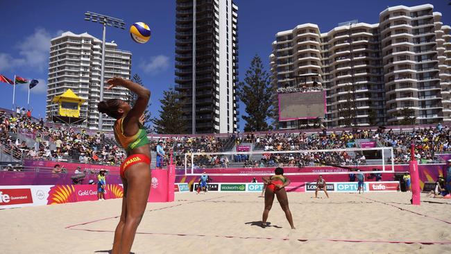 Renisha Stafford of Grenada serves as she and Thornia Williams of Grenada play against Scotland's Melissa Coutts and Lynne Beattie in their preliminary women's beach volleyball match at the 2018 Gold Coast Commonwealth Games on April 6, 2018. / AFP PHOTO / William WEST