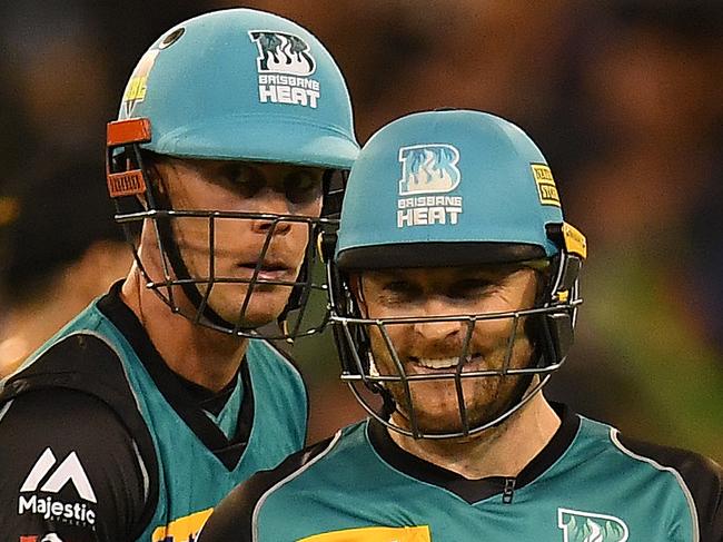 Chris Lynn (left) and Brendon McCullum of the Heat are seen after McCullum was dismissed during the the Big Bash League cricket match between the Melbourne Stars and the Brisbane Heat at the MCG in Melbourne, Tuesday, January 2, 2018. (AAP Image/Julian Smith) NO ARCHIVING, EDITORIAL USE ONLY, IMAGES TO BE USED FOR NEWS REPORTING PURPOSES ONLY, NO COMMERCIAL USE WHATSOEVER, NO USE IN BOOKS WITHOUT PRIOR WRITTEN CONSENT FROM AAP