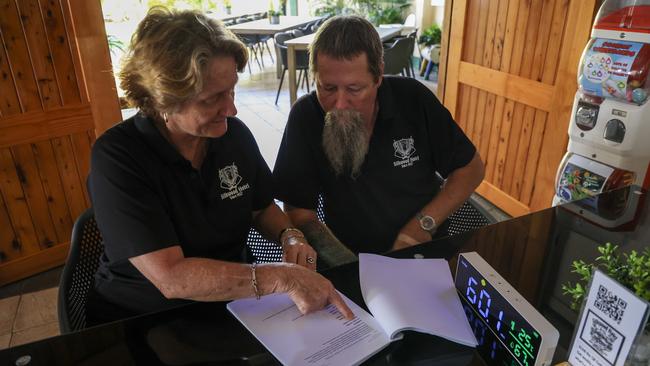 Silkwood Hotel owners Cassie and Paul Grover review an acoustic report they will be submitting to the Office of Liquor and Gaming Regulation in order to host live music exceeding 75 decibels. Picture: Arun Singh Mann