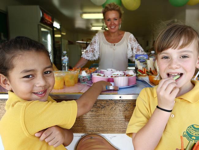 **WARNING** Embargoed until 5th of December. Pictured are students Ella Fretton 5 and Alyssah Price 7 with canteen lady Kathy Low, at Blairmount Public School today which has a healthy school canteen. Picture: Tim Hunter.