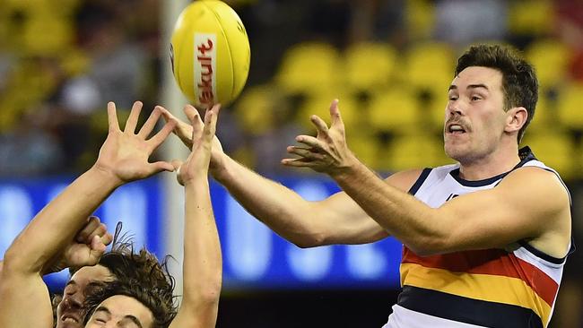 Adelaide’s Mitch McGovern flies for a mark in the 2018 round one AFL clash against Essendon at Etihad Stadium. Picture: Photo by Quinn Rooney/Getty Images.