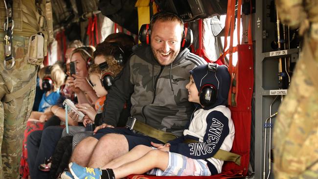 A father and son are jubilant that they are finally leaving Mallacoota. Picture: David Caird