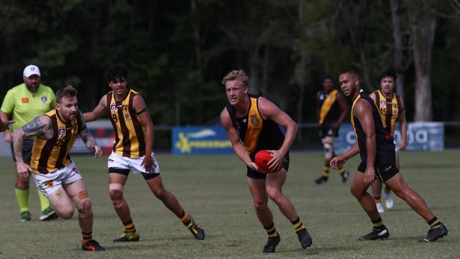 North Cairns Tigers Boe Collins evades traffic against the Manunda Hawks at Watsons Oval. Picture: Harry Murtough