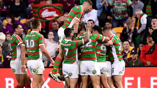 The Rabbitohs engulf Damien Cook at Suncorp Stadiuma. (Photo: Bradley Kanaris/Getty Images