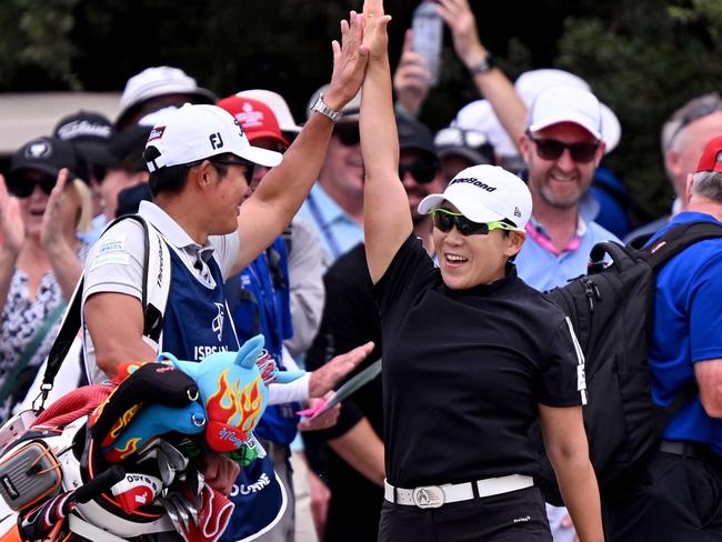 Jiyai Shin of South Korea celebrates with her caddie after making an eagle on the fourth hole during the final round of the 2024 ISPS Handa Australian Open Golf tournament at the Kingston Heath Golf Club in Melbourne on December 1, 2024. (Photo by William WEST / AFP) / -- IMAGE RESTRICTED TO EDITORIAL USE - STRICTLY NO COMMERCIAL USE --