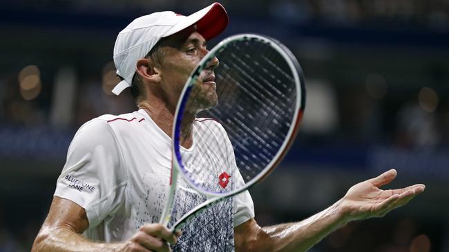 John Millman, of Australia, reacts to losing a point against Roger Federer, of Switzerland, during the fourth round of the U.S. Open tennis tournament, Monday, Sept. 3, 2018, in New York. (AP Photo/Adam Hunger)