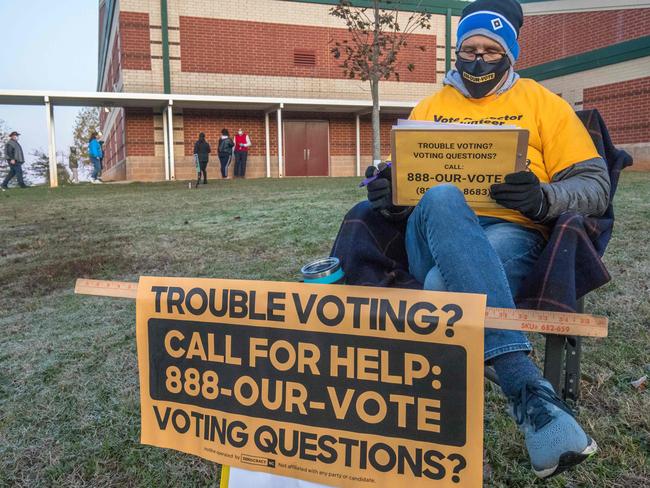 A volunteer with Democracy North Carolina shortly after the polls opened on November 3, 2020. Picture: AFP