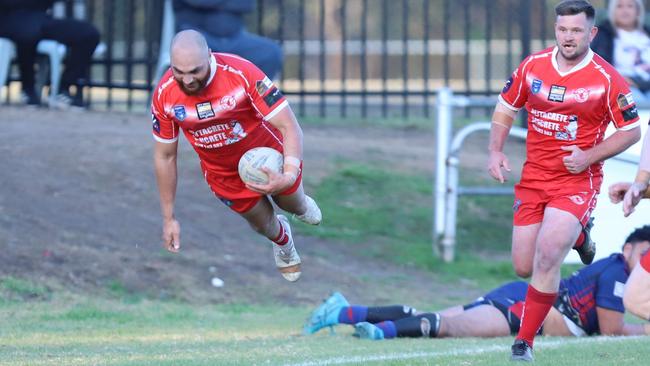 Take off: Blake Clayton scores for East Campbelltown Eagles against Campbelltown Collegians at Waminda Oval. Picture: Steve Montgomery