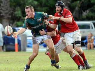 University’s Gavin Hams offloads after making a strong run at Victory Park yesterday. Picture: Warren Lynam