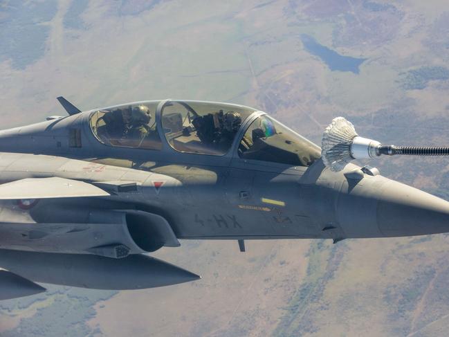 A French Rafale jet refuels mid-air about 100km south of Darwin. Picture: Floss Adams.