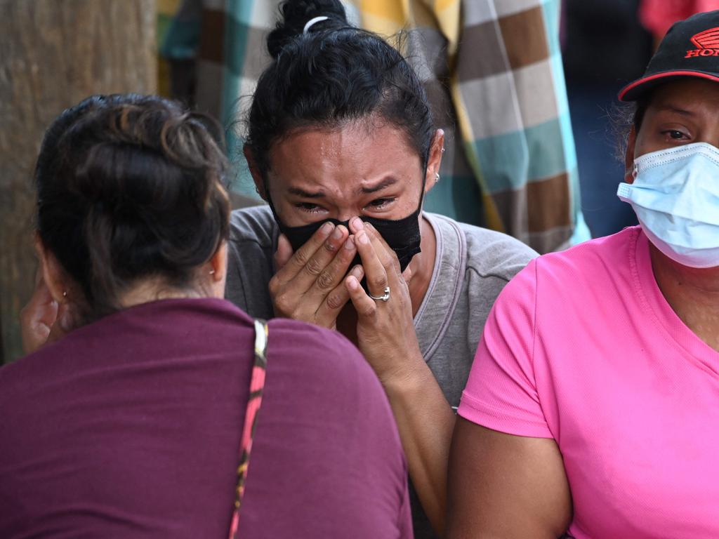 Relatives of inmates of the Women's Center for Social Adaptation (CEFAS) prison cry outside the detention centre after a fire following a brawl between inmates in Tamara. (Photo by Orlando SIERRA / AFP)